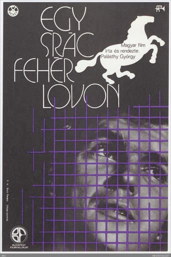 Egy srác fehér lovon